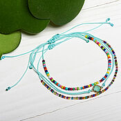 Украшения handmade. Livemaster - original item A set of bracelets made of multicolored beads on a turquoise thread. Handmade.