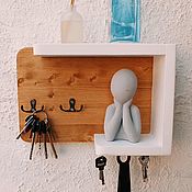Wooden housekeeper with shelf