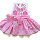 Dress for baby. Irish lace. Front view, with posocco
