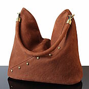 Bag-bag made of natural brown/yellow suede with a twisted handle