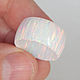 Wide ring made of white synthetic opal