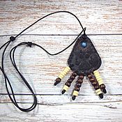 Украшения handmade. Livemaster - original item Leather pendant with embossed and beaded Trail of a wolf. Handmade.