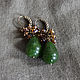 Drop earrings with gorgeous large jade rich color of green grass complemented by small faceted brownish yellow crystals with a Sunny amber glow.