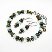 Украшения handmade. Livemaster - original item A bracelet made of moonstone and hematite beads in two colors. Handmade.
