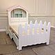 Baby cot in light milky tones for sweet dreams of a child. Made of two parts: First the bed with the footboard. The second-a wardrobe-cabin serves as a headboard.