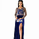 Dark blue velvet dress with embroidered lace bodice and back. The cut on his leg.
