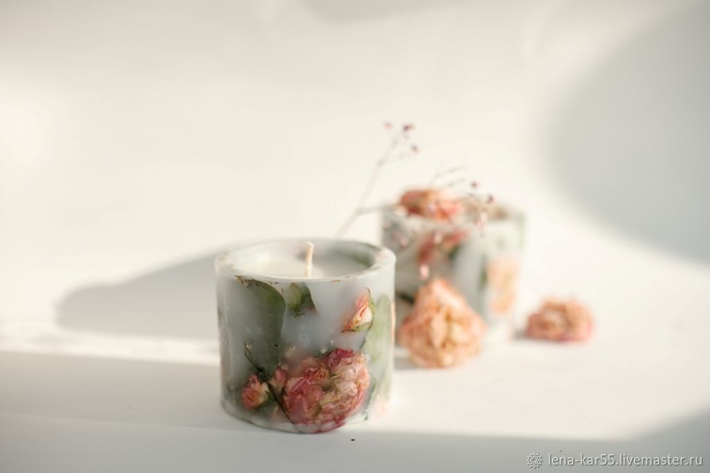 DIY wax candle making process. Woman making decorative wax candle and  decorates with dried flowers Stock Photo by fentonroma
