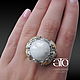 Made to order. Emigdio ring with cabochon white sapphire.
