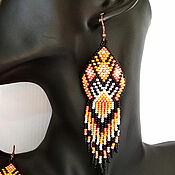Bright long beaded earrings in ethnic Boho style