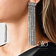 Very beautiful stylish earrings encrusted with CZ. Earring length 87 mm.
