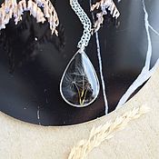 Pendant with a yellow flower. Transparent jewelry with real flowers
