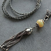Royal white amber. Silver necklace chain in the Baltic node