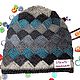 Knitted hat `Squares` are made of yarn dyeing sectioned and 100% wool. The hood is warm, not scratchy, after washing is not deformed.
