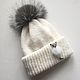 Knitted hat with pompom. Hat female. White cap