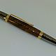 Strict design of this pen is perfectly combined with a properly chosen materials, namely, gold plated jewelry bronze, titanium, and stabilized American walnut.
