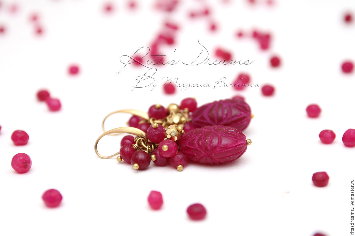 Brass earrings with large rubies carved drops of rich crimson and a bunch of smaller faceted and smooth ruby beads and beads made of brass.
