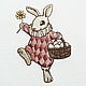 towels under the plate with the embroidery `the easter bunny` `sulkin house` embroidery workshop
