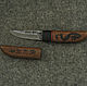 a small, sharp knife from Damascus and exotic wood Decorated with natural stone