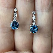 Classic earrings made of silver with natural sapphire