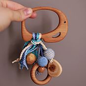 Rattle for the baby is a kind bear (a rodent, a gift to a newborn)