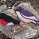 Brooch made of beads and beads Swallow and bullfinch
