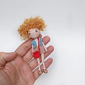 Frame knitted doll with natural goat hair
