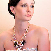 The necklace is long Yaroslavna with pearl and garnet