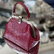 Handbag with clasp