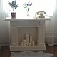White decorative fireplace, beautiful and functional. Decorating with candles and accessories will lend warmth and comfort to Your home.
