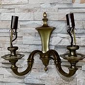 Wall-mounted, brass candlesticks.France