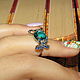 Кольцо из СЕРЕБРА 925 ПРОБЫ с покрытием родием, украшенное голубым топазом и россыпью сапфиров