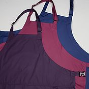 The apron is waterproof with a patterned braid Burgundy