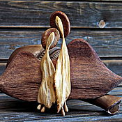 Angel of love.Figurine carved from wood