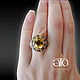 Gorgeous ring with a large yellow beryl and sapphires.

