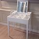 Белый будуарный столик со складным зеркалом и ячейками для хранения. Строгие прямые линии, фацет на зеркале - придают столику утонченность и лаконичность.