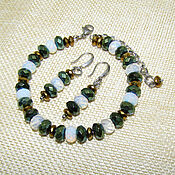 Украшения handmade. Livemaster - original item A bracelet made of moonstone and hematite beads in two colors. Handmade.