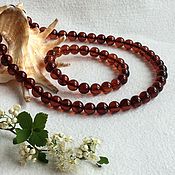 Buddhist rosary from Baltic amber, color is cherry