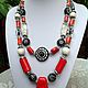 Necklaces, ethnic beads made from natural materials with beads of bright red coral. Rare unusual piece of jewelry with ethnic beads. Handmade .